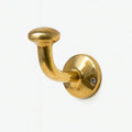 Solid brass hook for coats, towels, and purses in a bar, featuring a polished finish and sturdy construction to securely hold items while adding a stylish and durable accent to the space.
