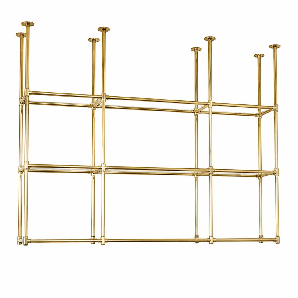 A modern brass wall-mounted shelving unit with a geometric grid design, featuring six open compartments and multiple vertical support rods, shown against a plain white background.