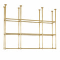 A modern brass wall-mounted shelving unit with a geometric grid design, featuring six open compartments and multiple vertical support rods, shown against a plain white background.