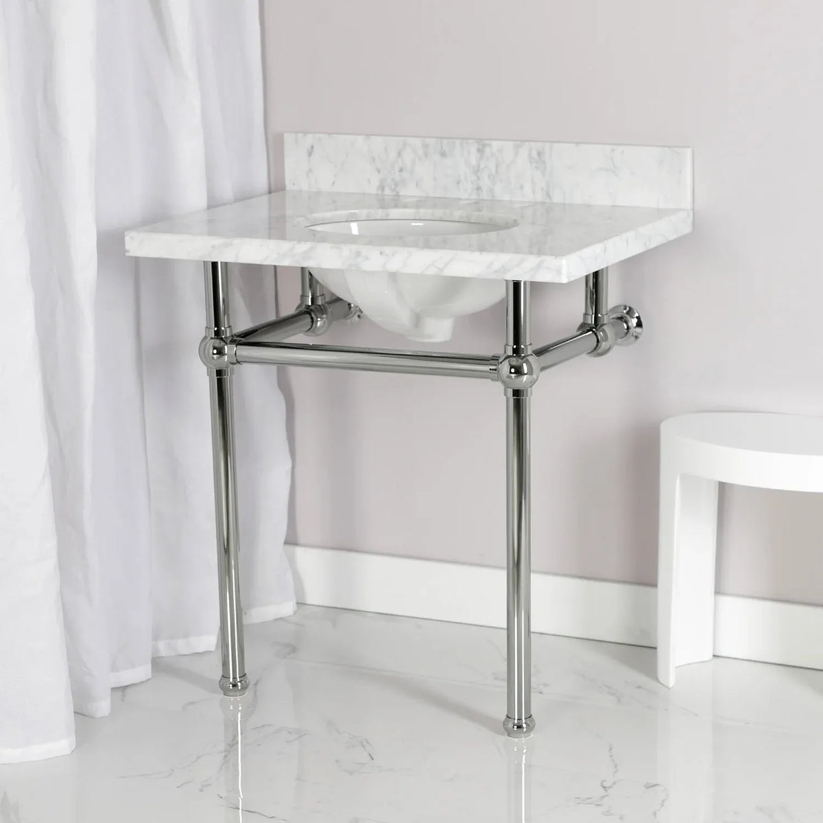 marble sink with a polished nickel console on it wall and floor mounted