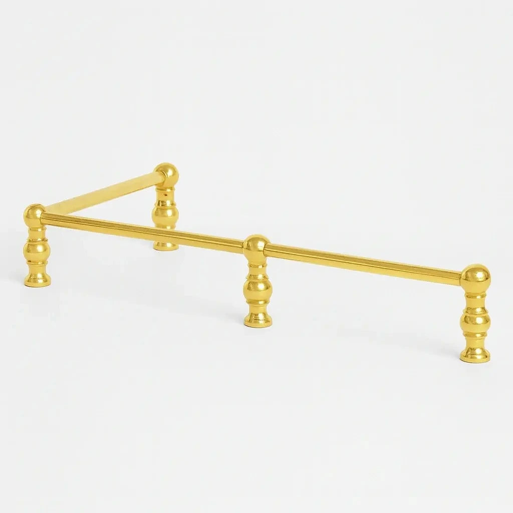 Brass bottle shelf and holder with a polished finish, designed to securely store and display bottles while adding an elegant and functional touch to any bar or countertop.