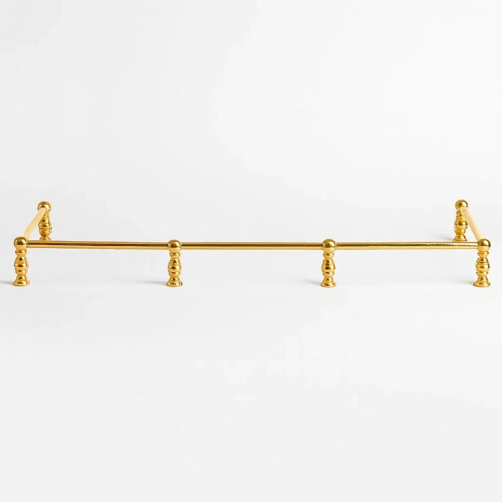 Brass bottle shelf and holder with a polished finish, designed to securely store and display bottles while adding an elegant and functional touch to any bar or countertop.